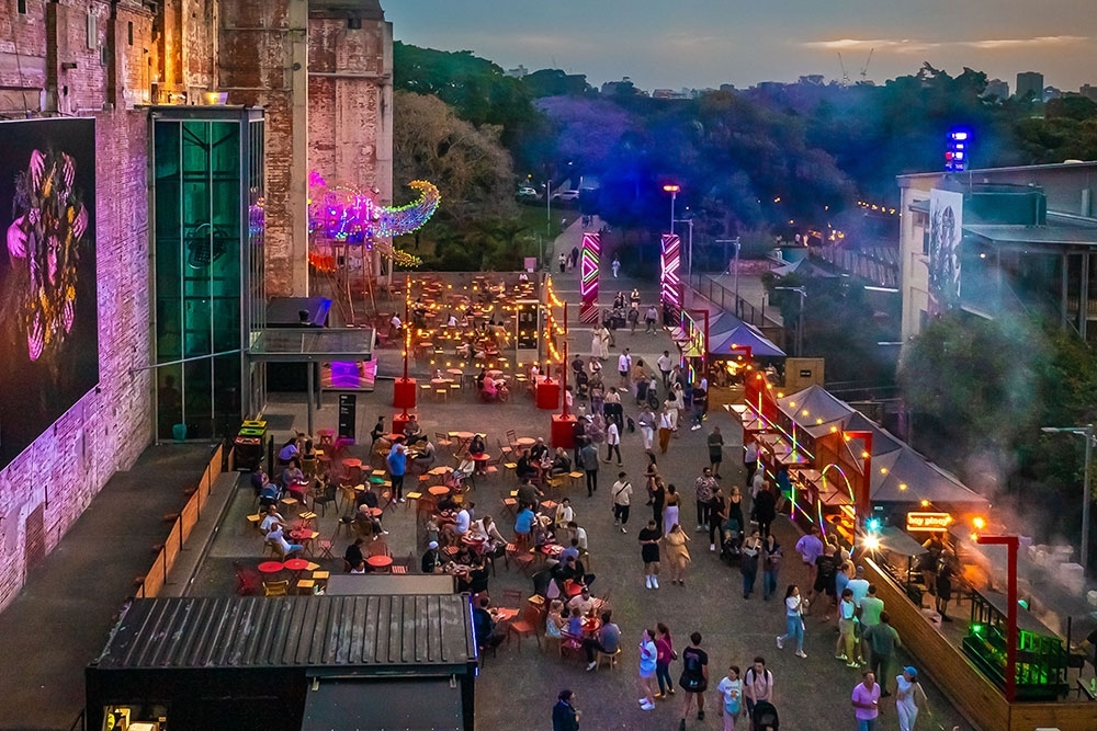 Elevated view of the Night Feast precinct with vendor tents and seating zones